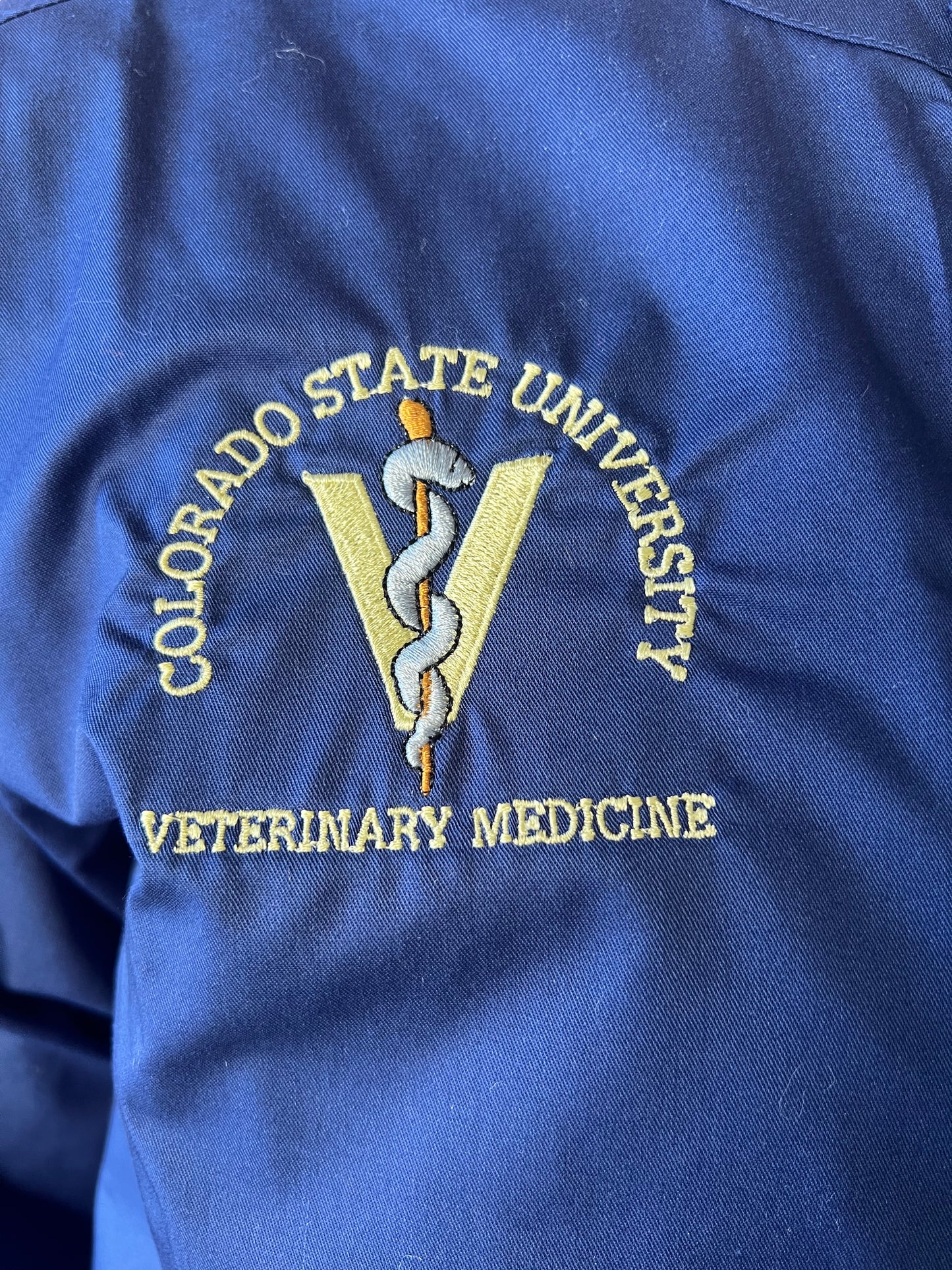 Unisex Clinical Smock Scrub Jacket - Retired Rod of Asclepius Logo